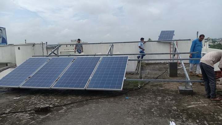 Solar Care Pro team installing panels on rooftop